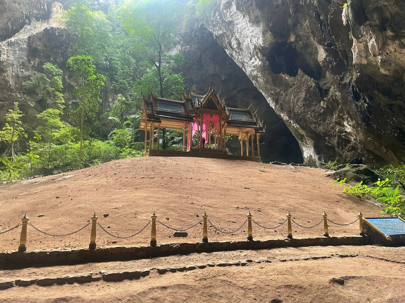Kuha Karuhas Pavilion inside Phraya Nakhon Cave with sunlight streaming through the cave opening